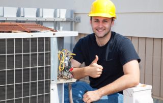 a man giving a thumbs up by an hvac unit