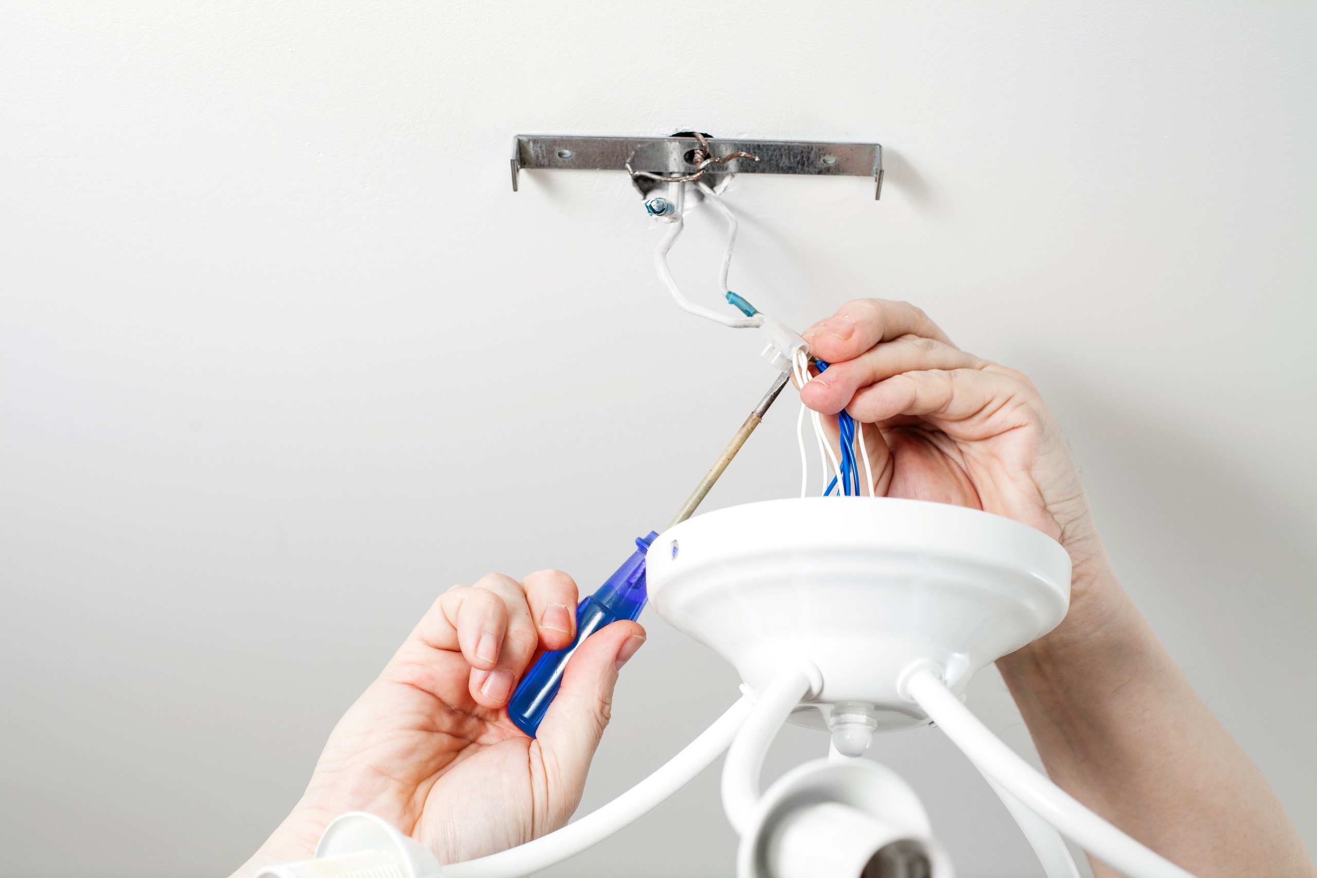 a man servicing some electrical wires