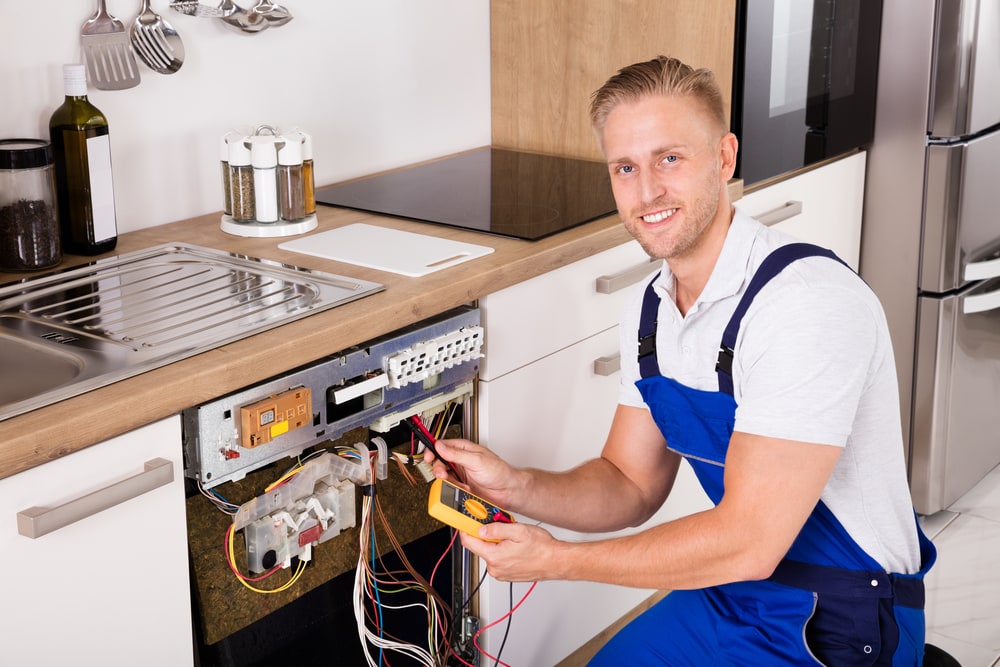a man servicing a washing machine