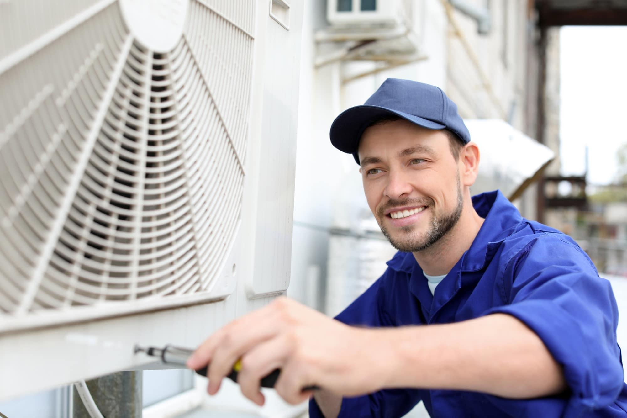 a man servicing an hvac unit